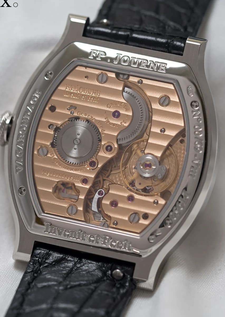 Power reserve indicator detail at 1 o'clock with blued steel hand and red warning sector, bezel transition visible