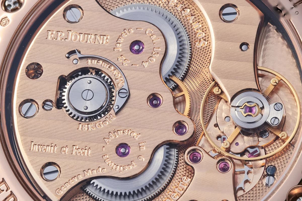 Movement detail of the Caliber 1304 showing the circular graining on the base plate and polished screw heads.