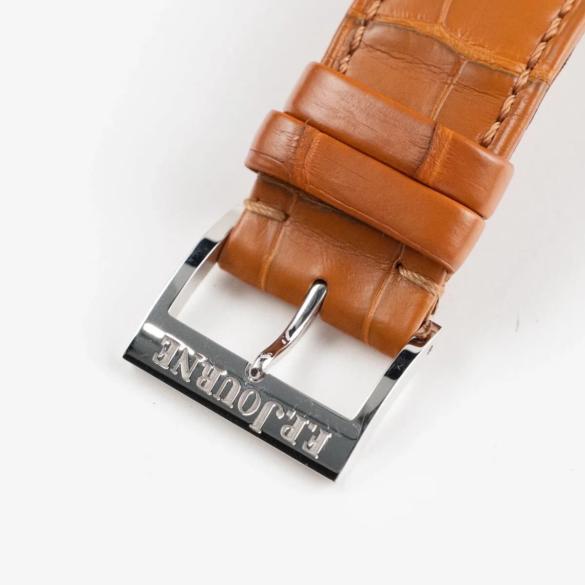 Side profile showing the 8mm case thickness, domed sapphire crystal, and the polished rose gold case flanks.