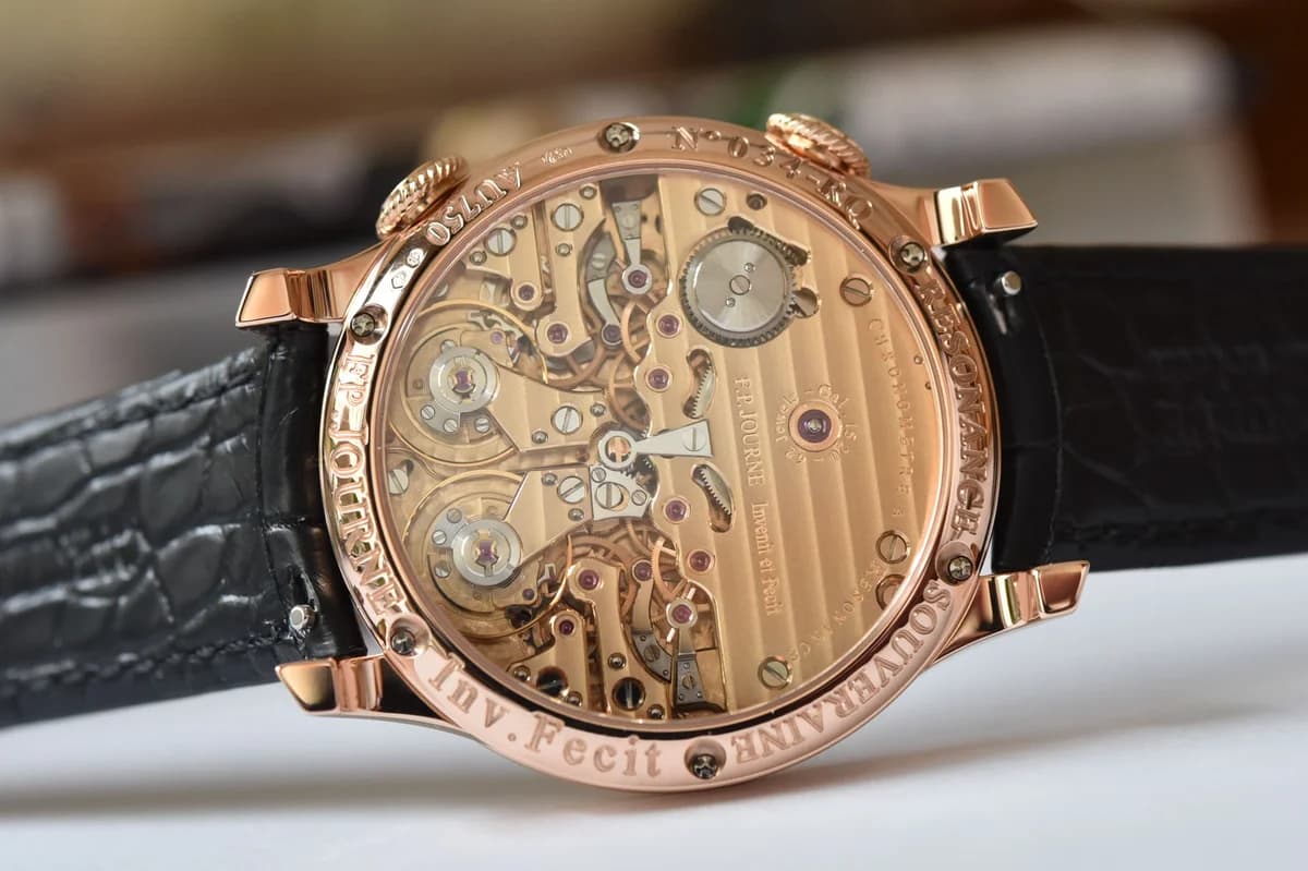 Dial detail of the Chronometre a Resonance in rose gold. The Remontoirs d'Egalites inscription, blued steel hands, and the central resonance aperture showing the twin balance wheel bridge.