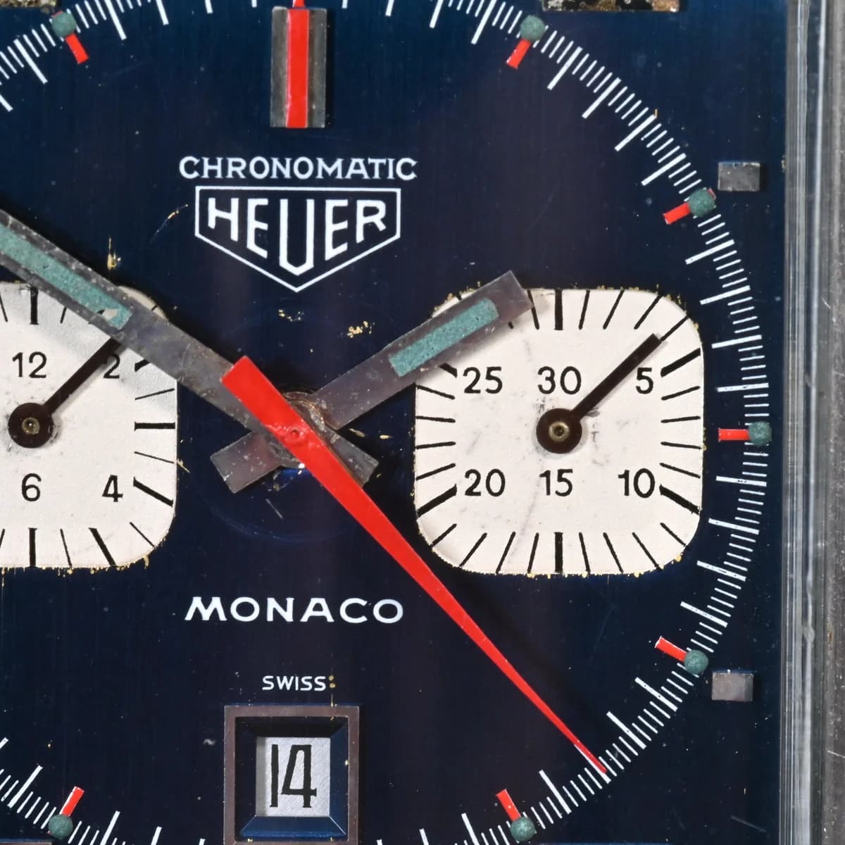 The crown and chronograph pushers in detail. Crown at 9, pushers at 2 and 4. The asymmetry is the Monaco's most recognizable feature.