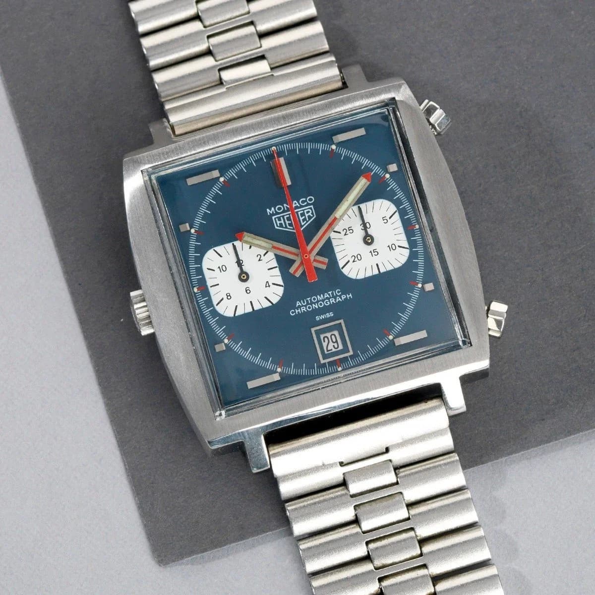 Solid caseback engraved with "Tool No. 033" and the Heuer shield logo. The snap-on construction was part of Erwin Piquerez's waterproof square case design.