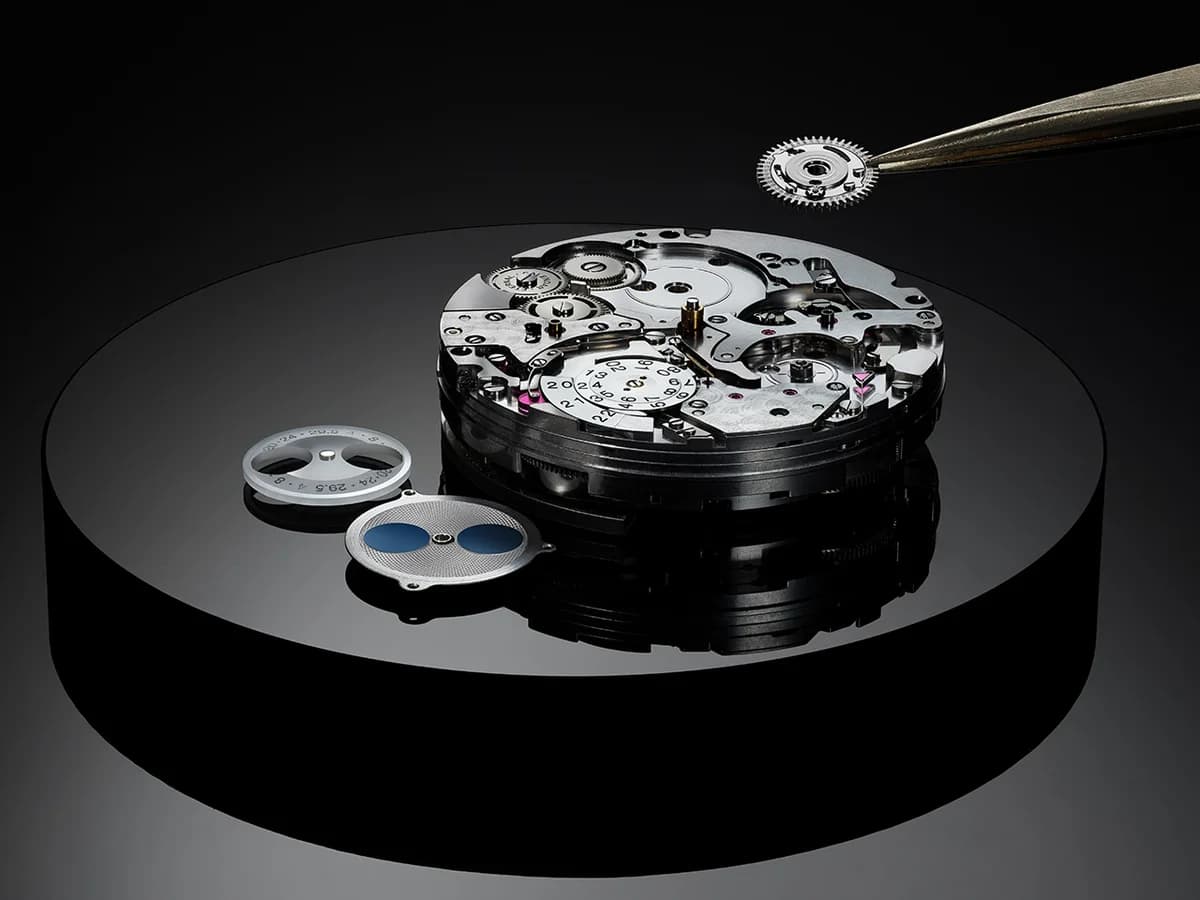Caliber 52640 movement assembly with the 400-year gear, moon phase discs, and sapphire calendar bridge visible