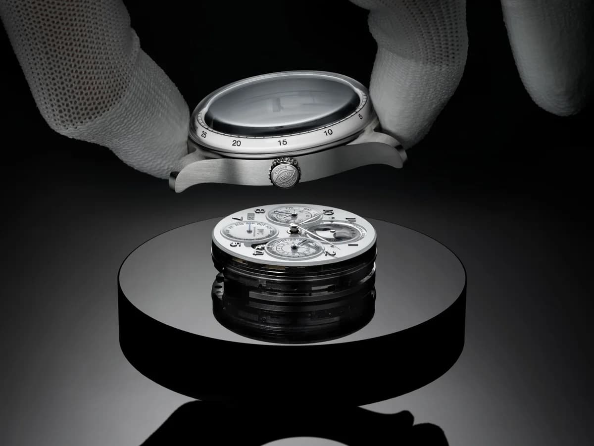 Moon phase disc assembly showing the Double Moon display with guilloched sky and the precision reduction gear train