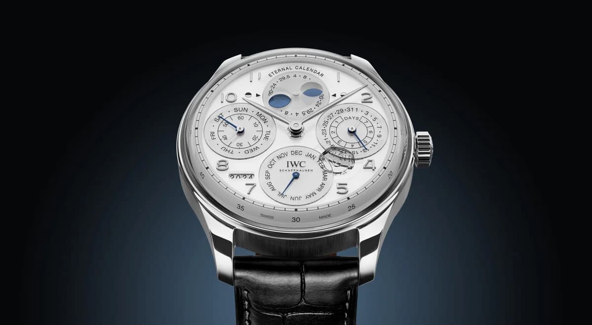Three-quarter view highlighting the platinum case profile, brushed casebands, and the iconic Portugieser crown