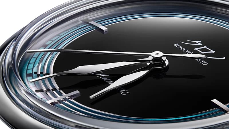 Hand-bent hands following the cylindrical dial curvature