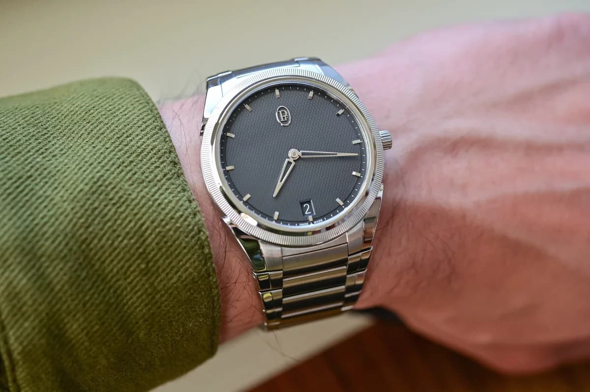 Caliber PF703 through the sapphire caseback showing the balance wheel and movement finishing