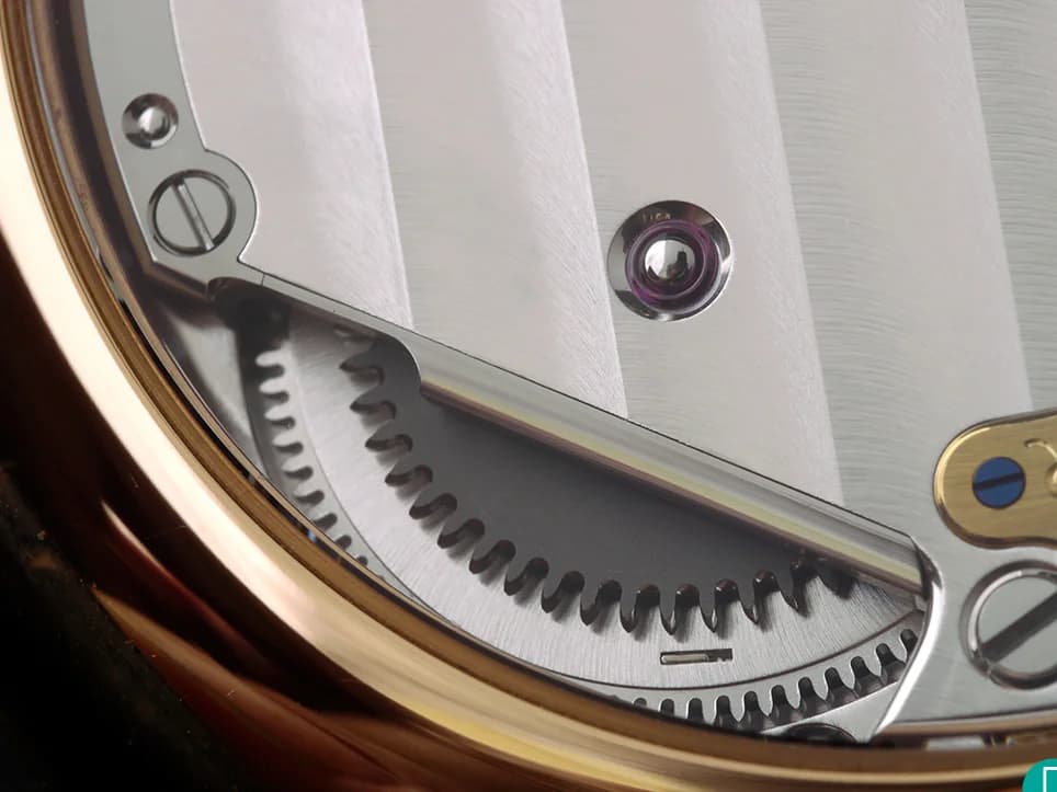 Profile view on alligator strap. The polished rose gold case catches light along every surface.