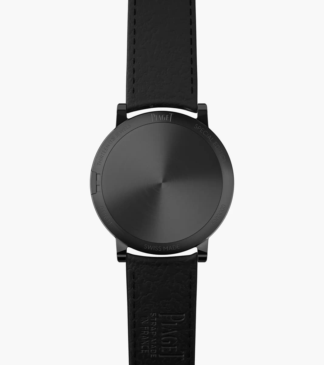 The side profile tells the whole story. Two millimeters from caseback to crystal, thinner than most watch movements alone.