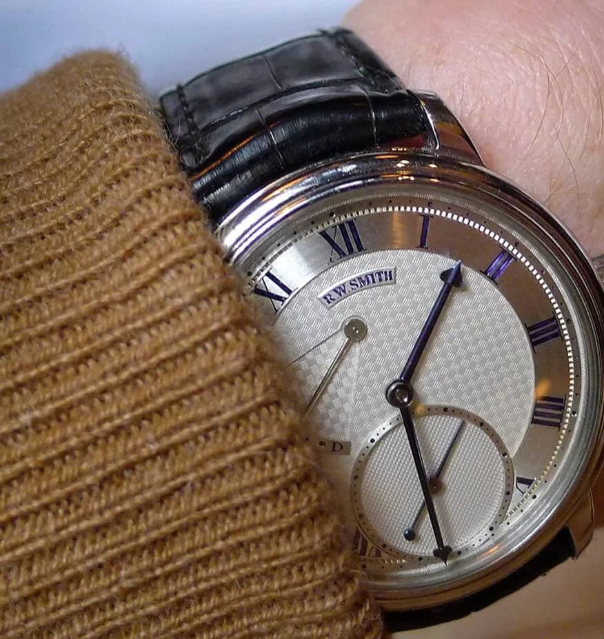 The Series 2 in rose gold with two alligator strap options. The watch is shown on a black strap with a brown alternative alongside, demonstrating the versatility of the strap change.