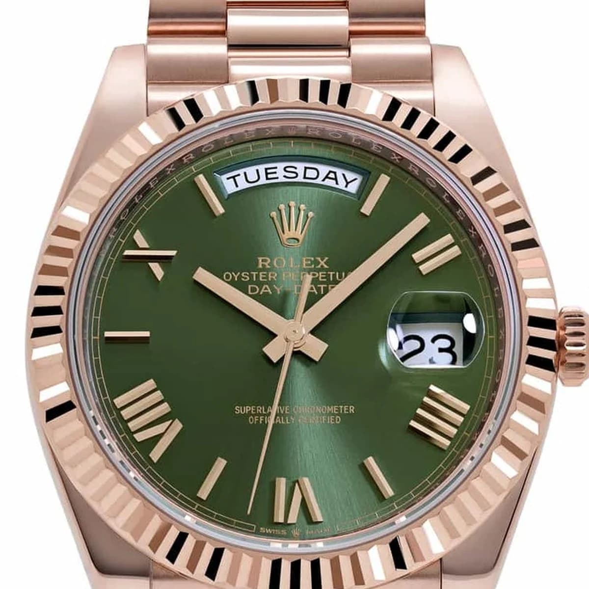 The Rolex Day-Date 228235 in Everose gold with olive green sunburst dial and Roman numeral markers.