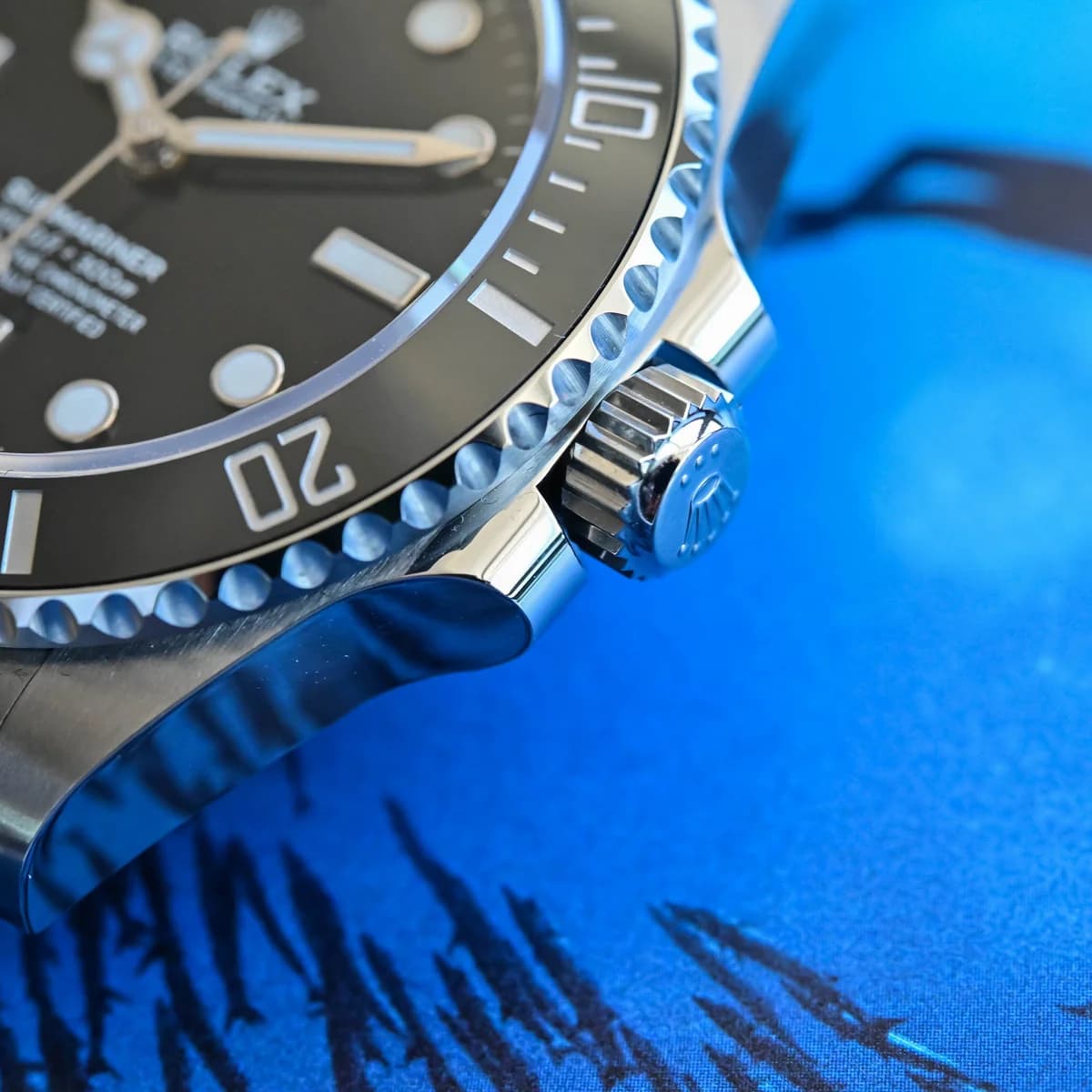 Triplock screw-down crown with Rolex logo between crown guards