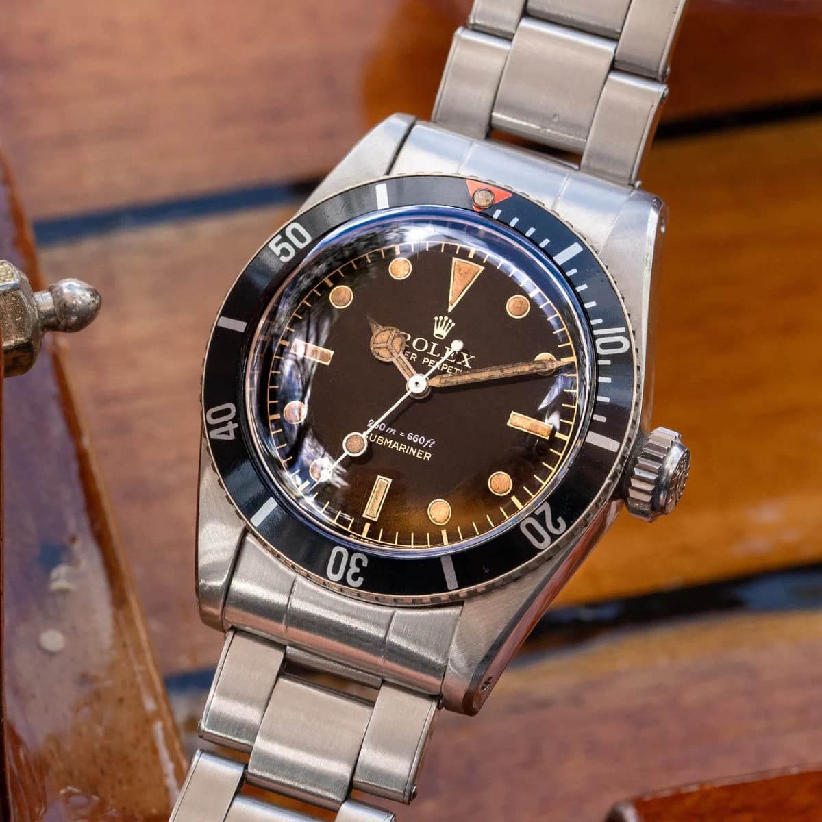 Three-quarter crown view: the Big Crown's Brevet marking and the watch's compact profile without crown guards