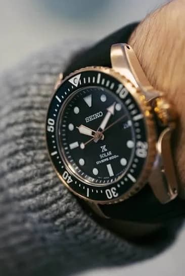 Three-quarter angle showing the cushion case profile and coin-edge bezel