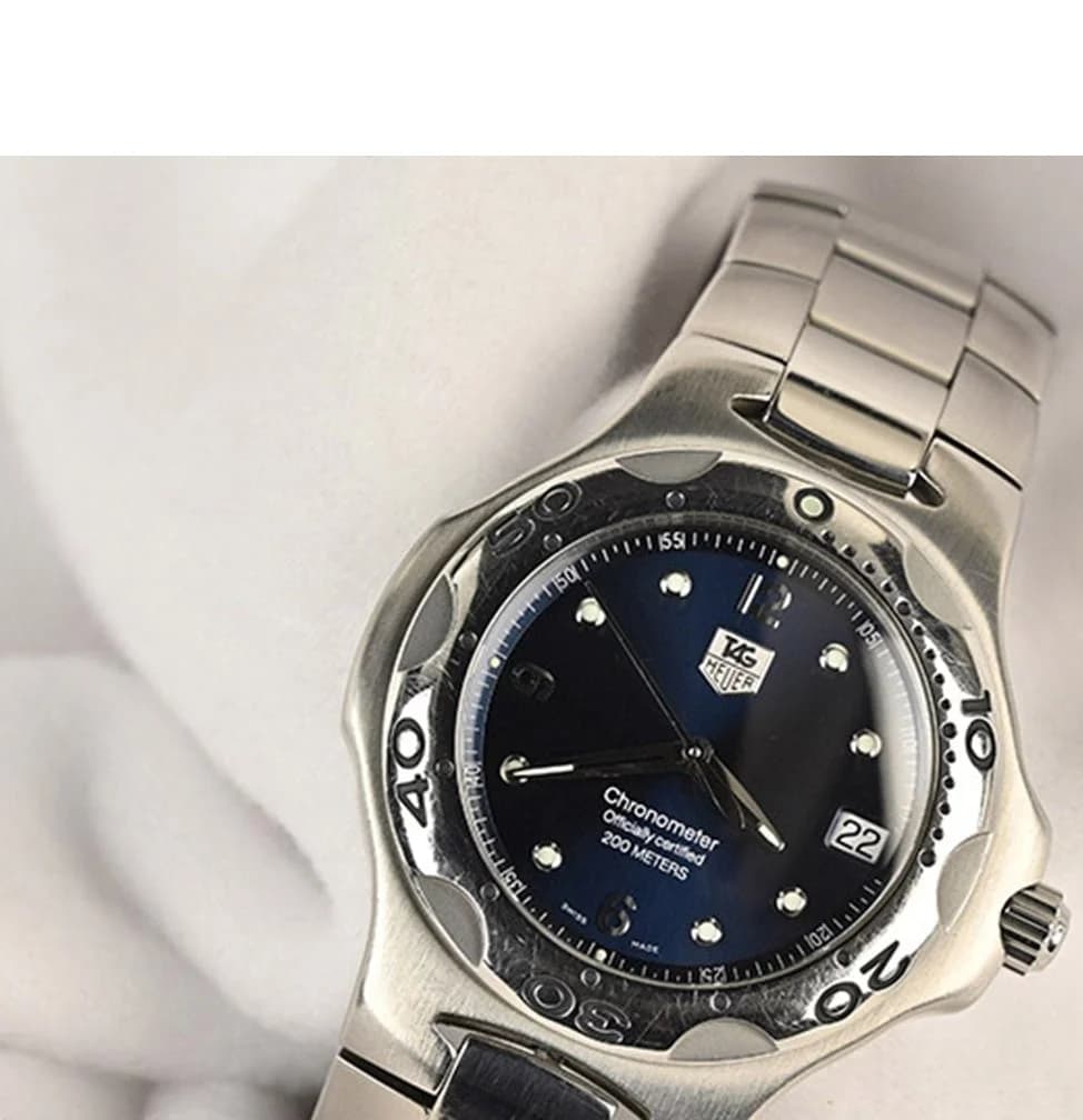 Three-quarter view showing the integrated bracelet flowing into the case