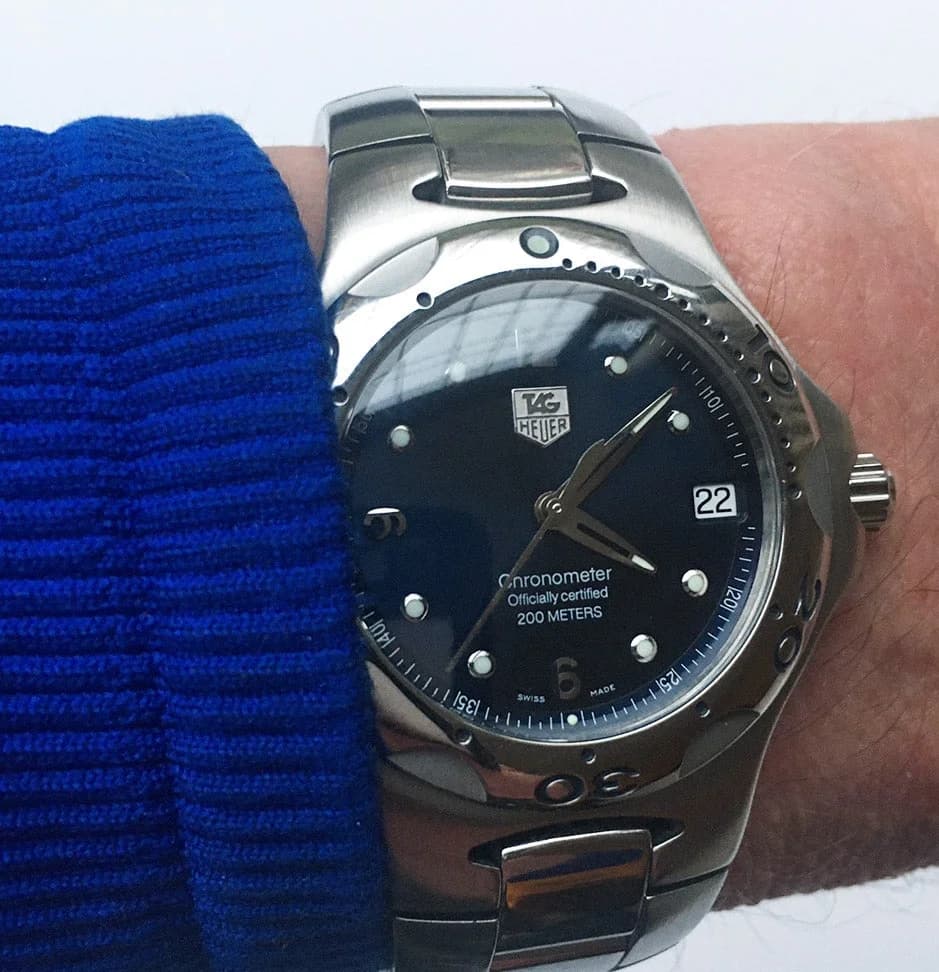 Caseback detail at angle showing the sculpted case-to-bracelet transition