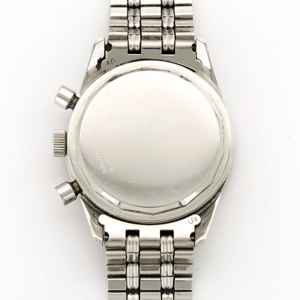The crown flanked by two chronograph pushers. The Universal Geneve logo is stamped on the crown.