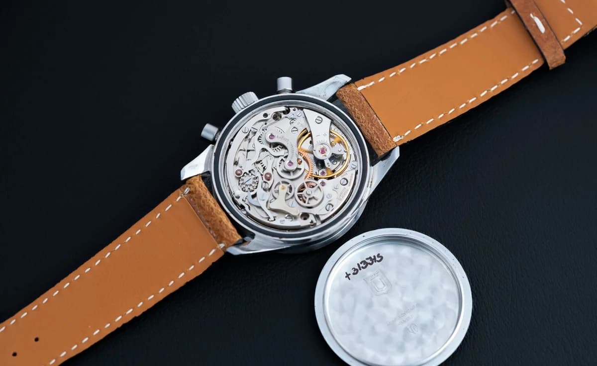 The 885103/02 on a brown leather strap, the way Nina Rindt wore hers. The warm leather against the white dial is the most iconic configuration.