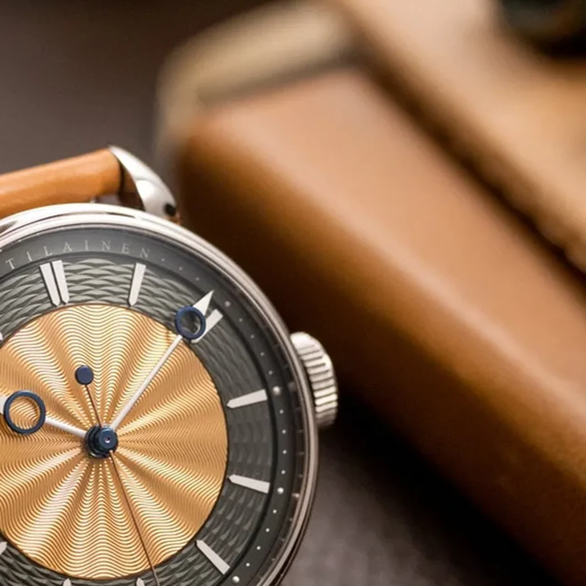 Close-up showing the guilloche textures, applied indices, and VOUTILAINEN branding
